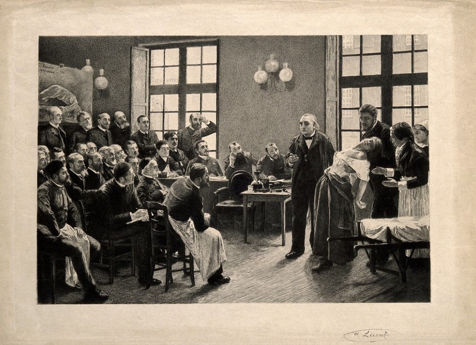 Black-and-white engraving depicting a 19th-century medical lecture at the Salpêtrière hospital.