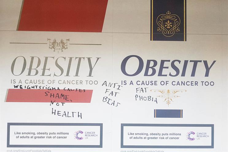 Health campaign poster that obesity is a cause of cancer tagged with graffiti e.g. "fat phobia".