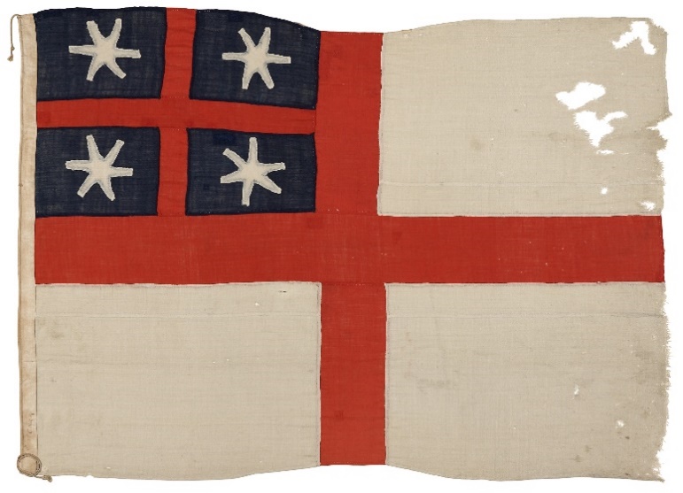 The United Tribes flag, adopted in 1834. The flag fabric appears worn, with some tearing and holes.