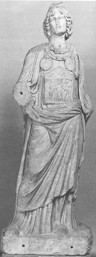 A statue of Gallus, a Roman priest, depicted in a standing position. The statue is made of white marble and showcases intricate details, including a flowing robe and a laurel wreath on his head.