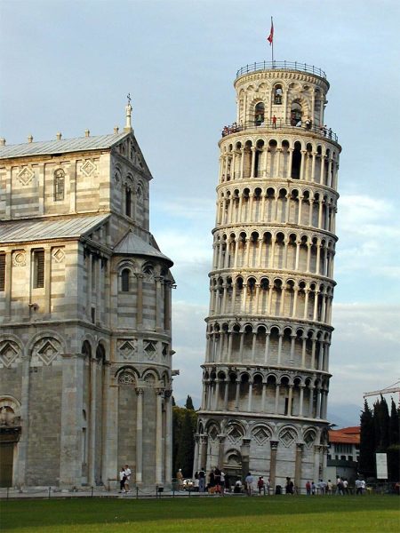 Photograph showing a medieval tower leaning towards its right side.