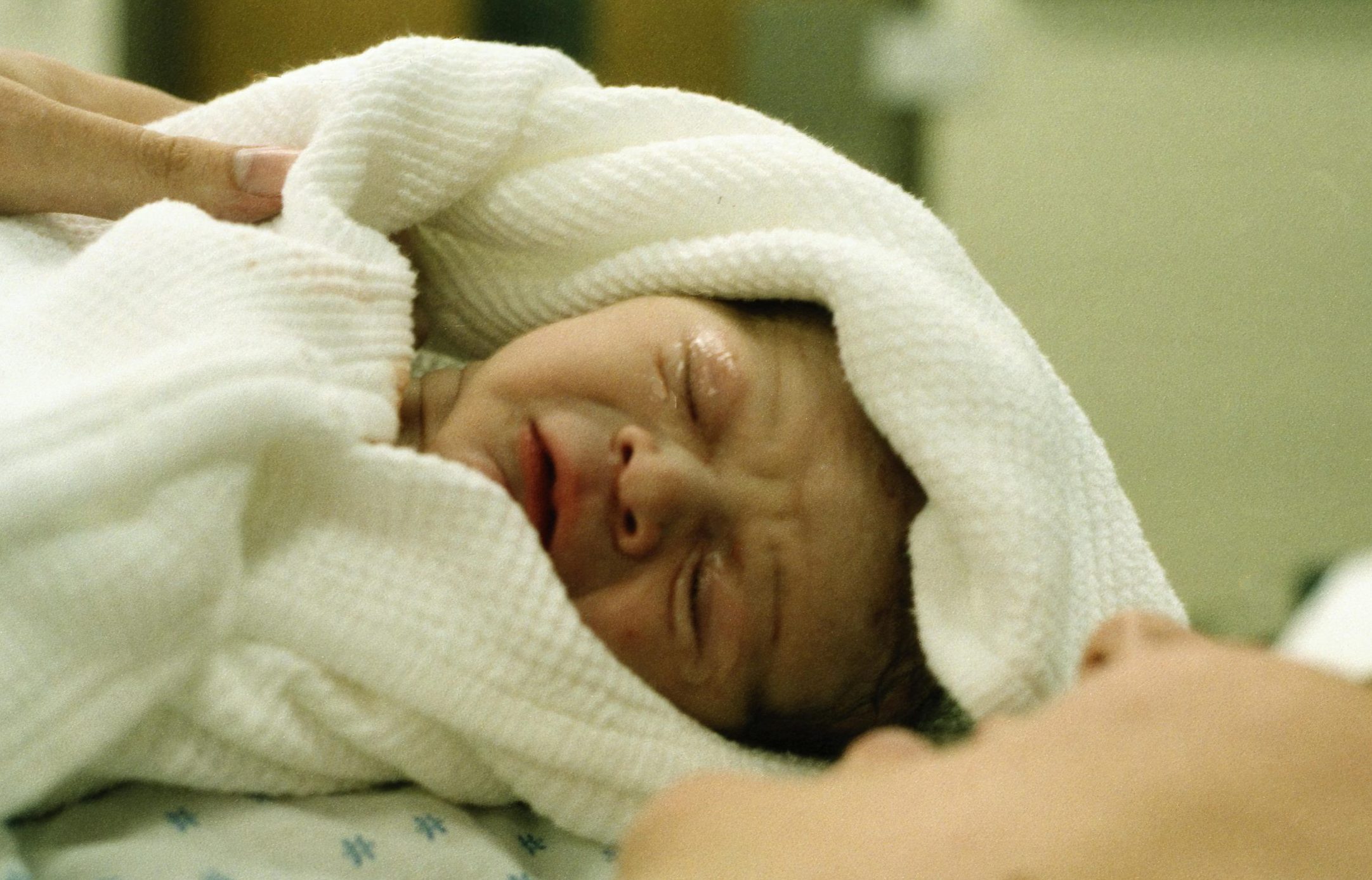 Baby in white blanket