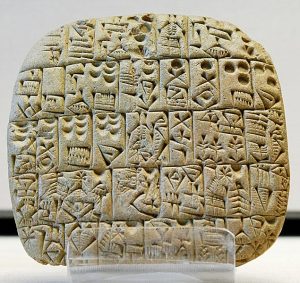 An image of the Sumerian tablet from the Louvre, showing a sales contract for a house and field.