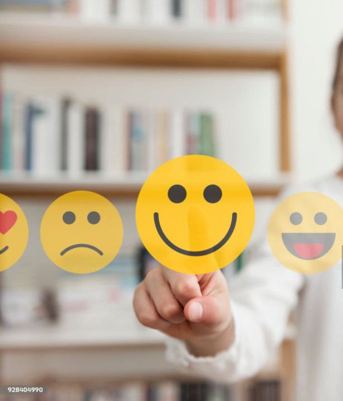 Child choosing happy emoji