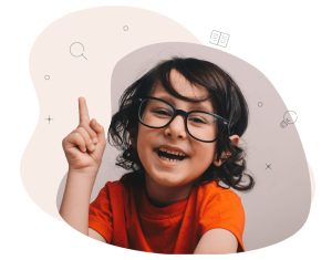 A child with brown hair and glasses is pointing towards the sky. He is smiling and wearing a bright orange T-shirt