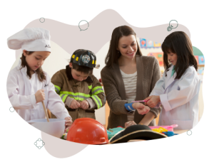 Three children dressed as a chef, fire person and doctor. The child dressed as a doctor to pretend playing with the teacher