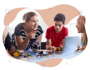 Teacher interacting with a group of older primary school students. They are discussing what they have just made and built using different materials.