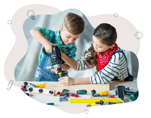 Two children playing with a plastic drill, pretending to drill into a piece of wood.