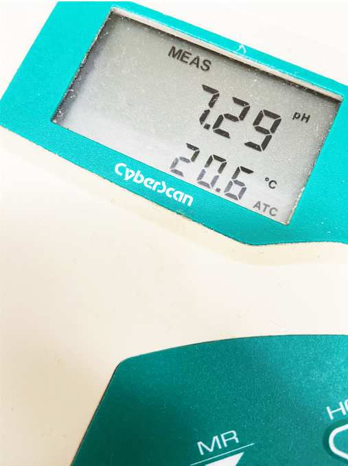 The LCD display of a pH meter indicating a pH of 7.29.