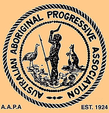 The words "Australian Aboriginal Progressive Society" circle an image of an First Nations figure who is flanked by a Emu and Kangaroo. The bottom left of the logo reads "A.A.P.A" and the bottom right reads "EST. 1924"