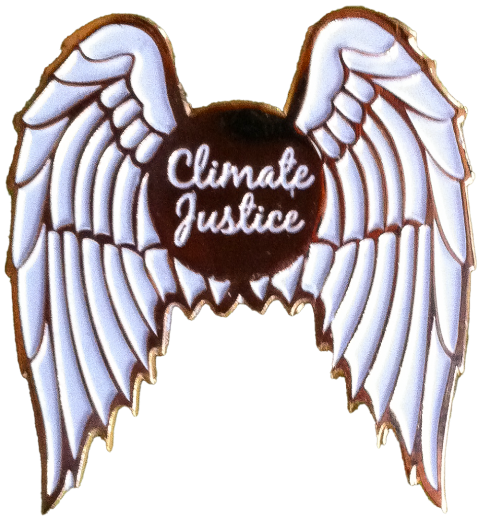 A pin featuring white angel wings and a circular center with the words “Climate Justice” written in white cursive text.