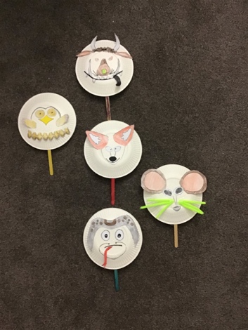Puppets made from faces drawn on a paper plate and then stuck on a stick 'handle'.