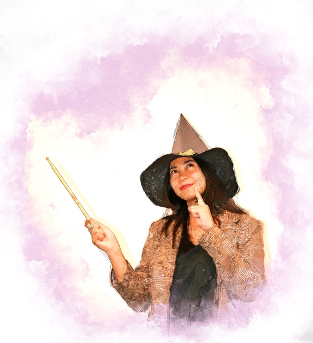 Charlotte wears a witches hat and holds a wand. She is looking thoughtful.